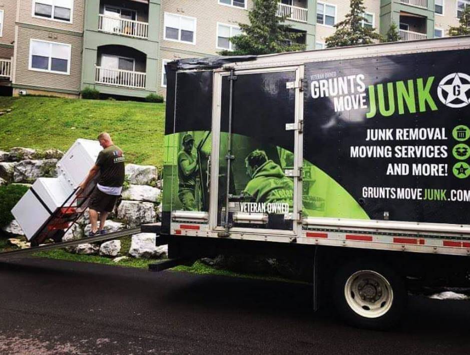 A man loading junk in the Grunts Junk Move truck
